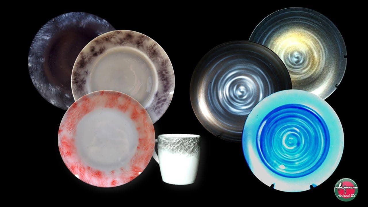 Airbrushed tableware designs in an official AirbrushBD page photo.