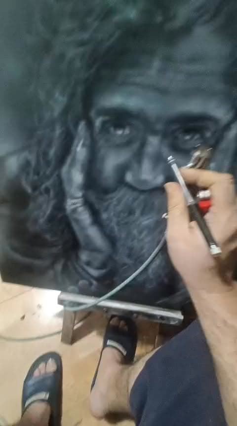 Poster frame from the AirbrushBD reel showing the Destitute King artwork being airbrushed.