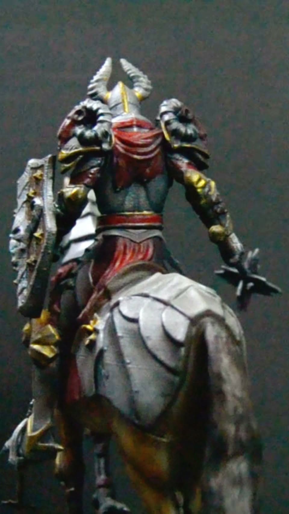 Poster frame from the AirbrushBD reel showing a 3D-printed knight model being airbrush painted.